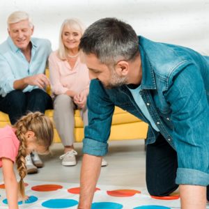 dad playing twister with daughter